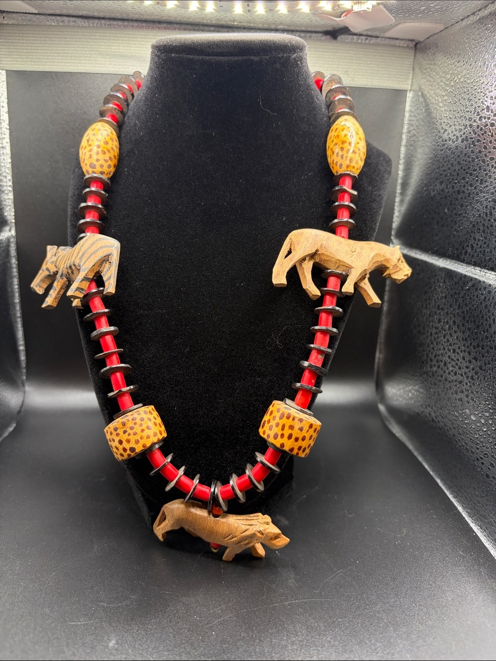 African hand crafted safari themed, carved wood animals and beading. 24”